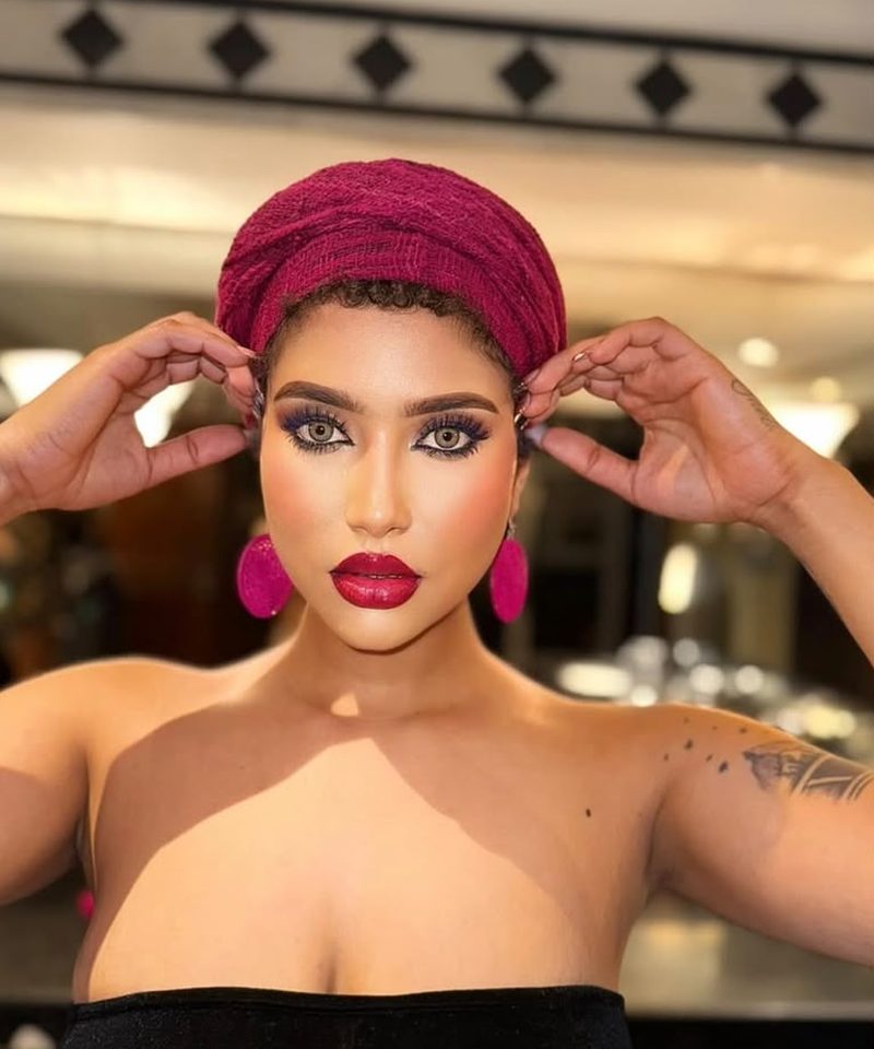 Glam makeup look styled with a maroon headwrap