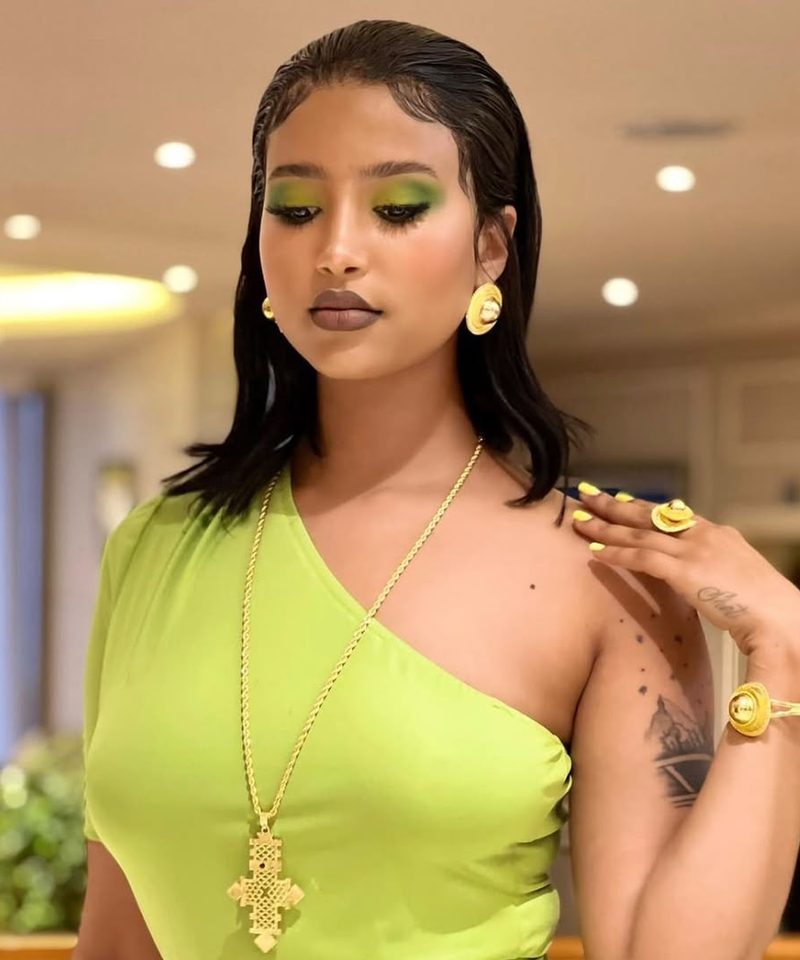Habesha gold jewelry and green glam makeup look