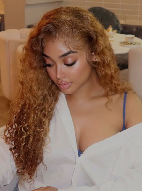 Copper balayage hair color on curly hair