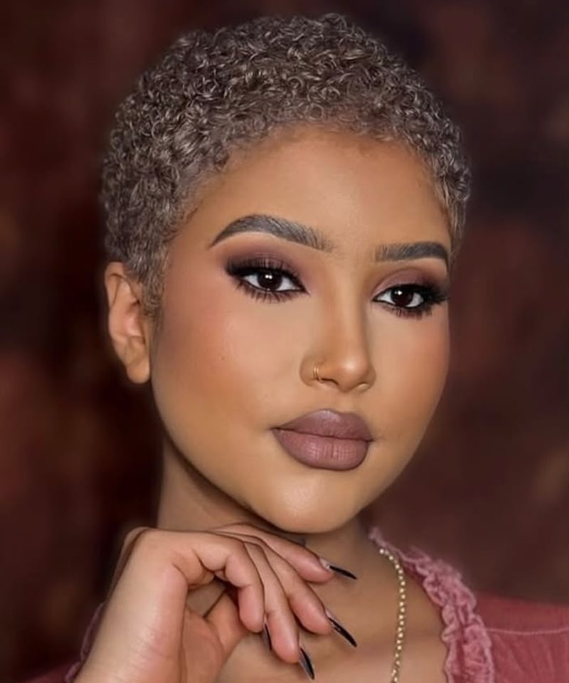Short pixie cut with bold gold eyeshadow