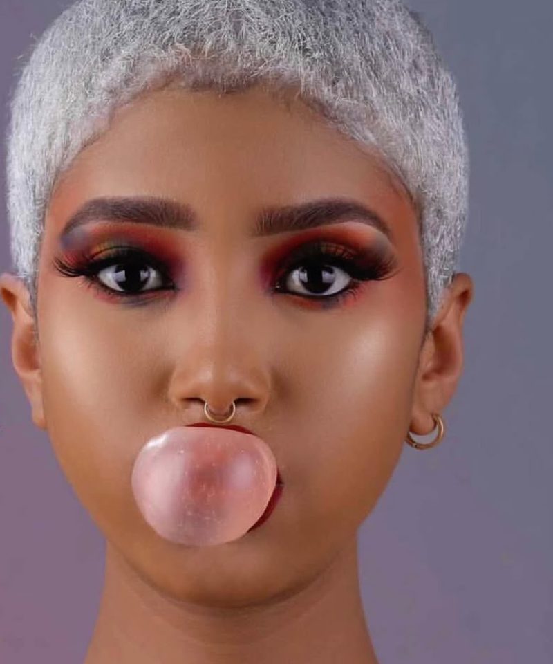 Silver pixie cut with sunset toned eyeshadow